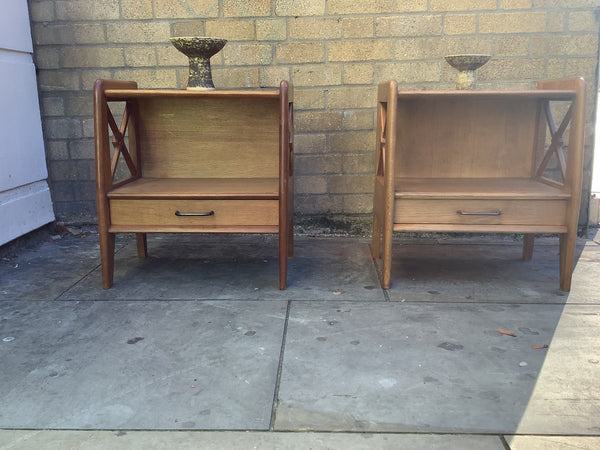 A pair of bedside cabinets by Jacques Adnet