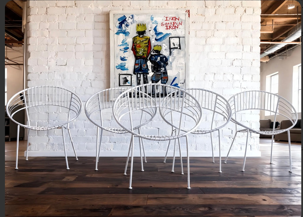 vintage mid-century white "Atomic Hoop" garden chairs.