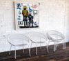 vintage mid-century white "Atomic Hoop" garden chairs.