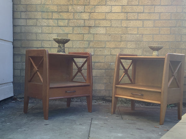 A pair of bedside cabinets by Jacques Adnet