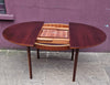 Rosewood round extendable dining table by Mclntosh 1960