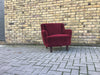 Small vintage upholstered armchair