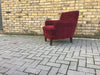 Small vintage upholstered armchair